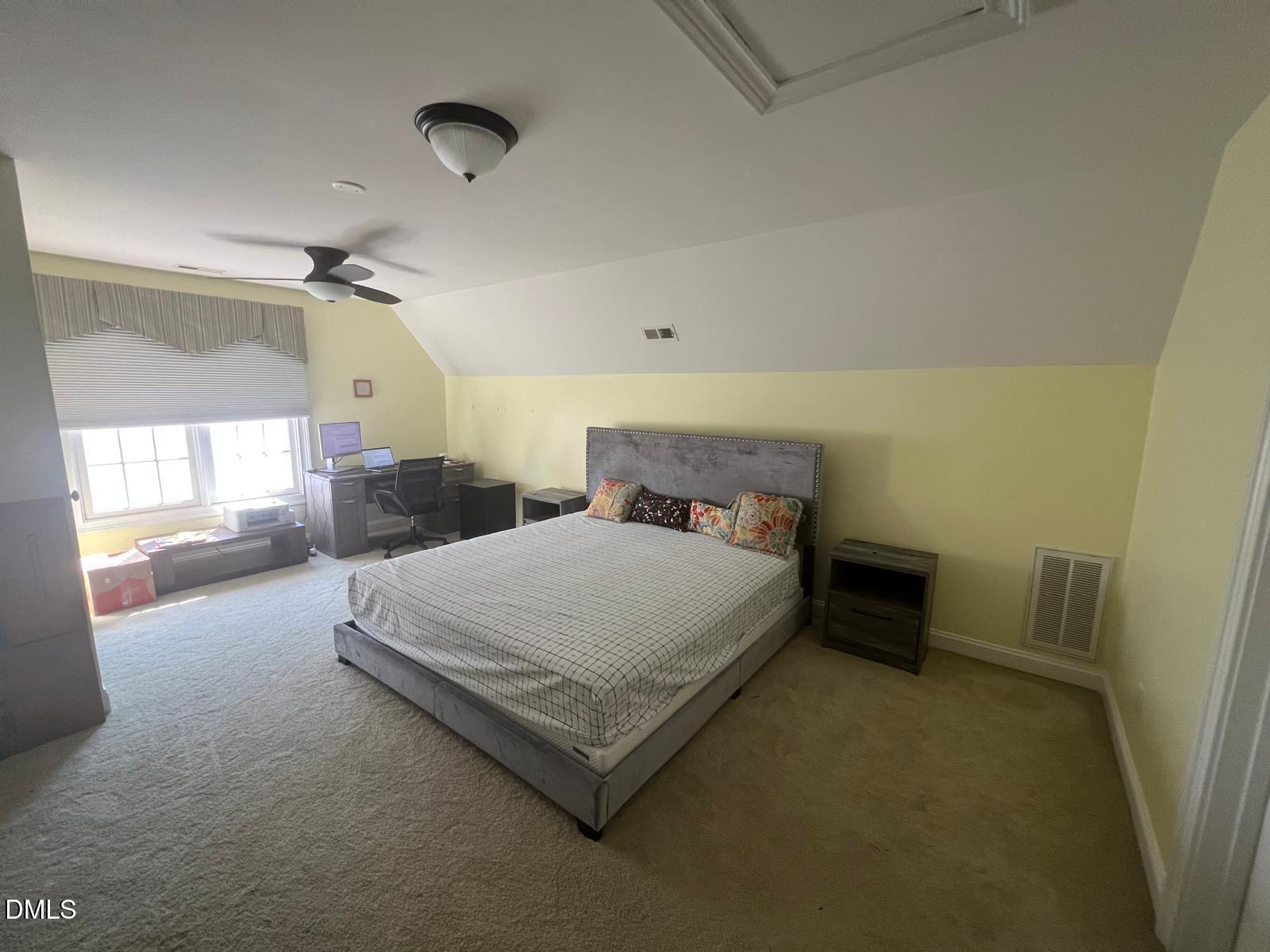 133 Fort Jackson Road Morrisville, NC 27560 - Photo 21 of 25 a spacious bedroom with a bed and window