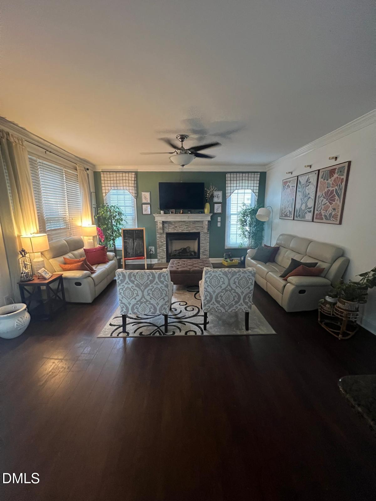 133 Fort Jackson Road Morrisville, NC 27560 - Photo 22 of 25 a living room with furniture and a fireplace