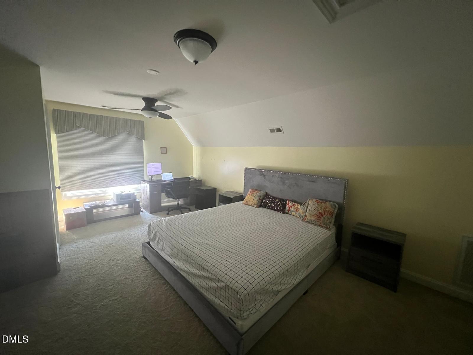 133 Fort Jackson Road Morrisville, NC 27560 - Photo 23 of 25 a bedroom with a bed and a night stand