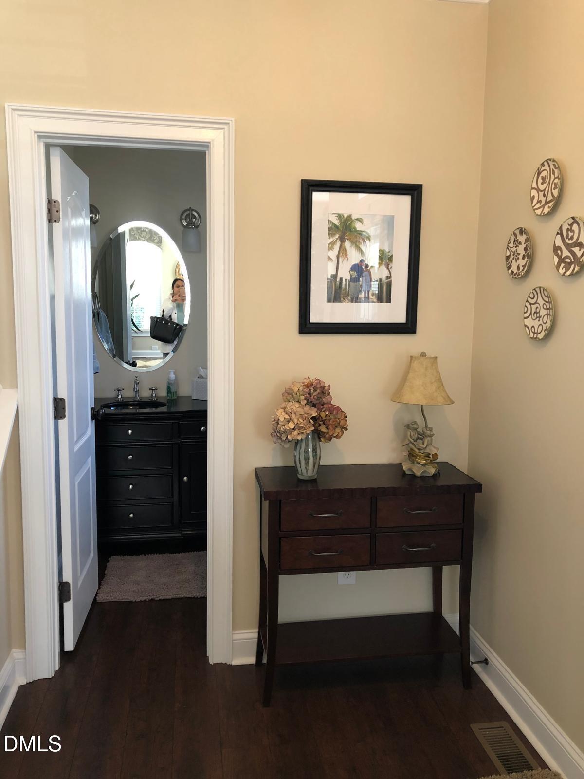 133 Fort Jackson Road Morrisville, NC 27560 - Photo 4 of 25 a view of a hallway with front door and wooden floor