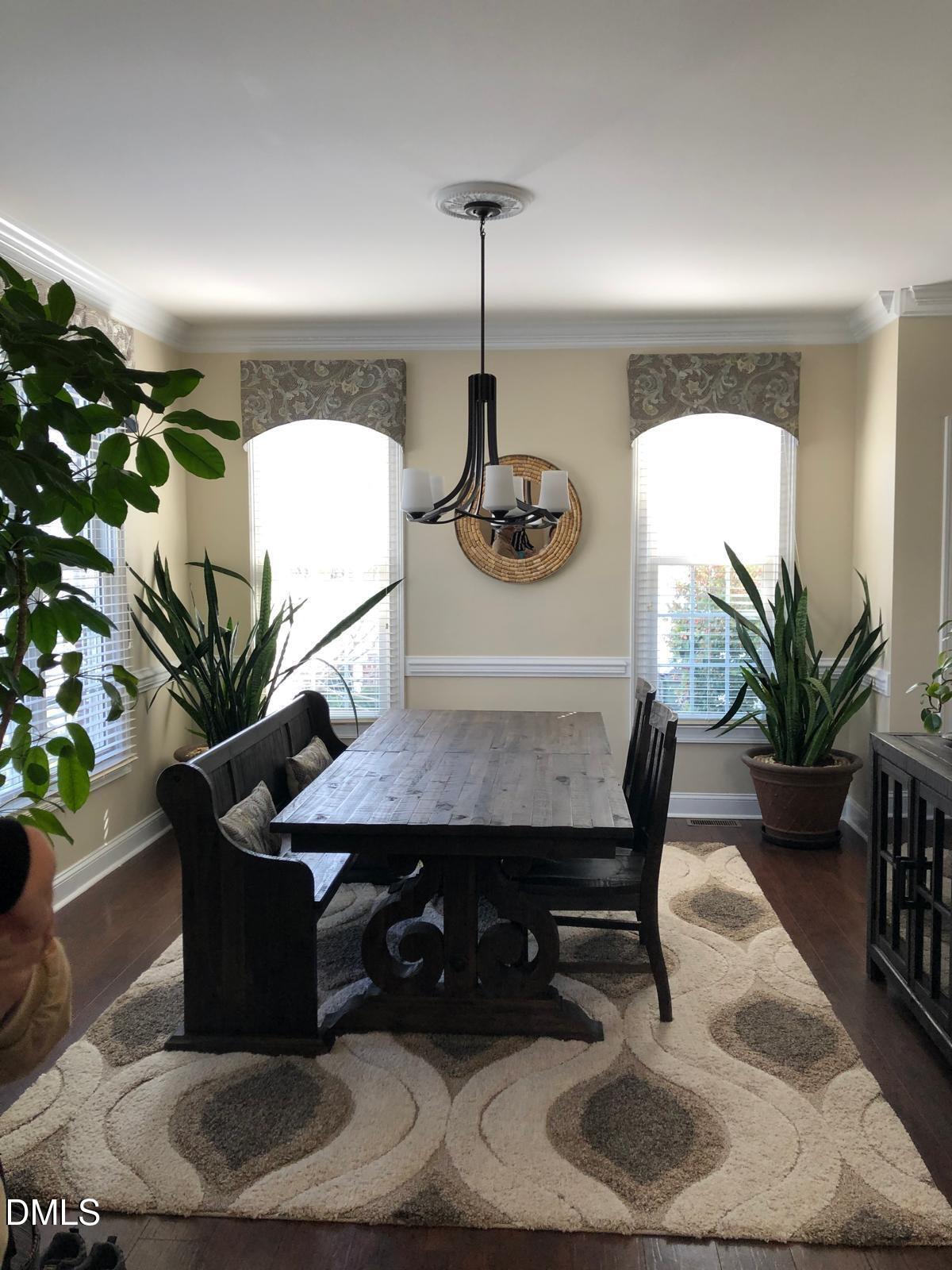 133 Fort Jackson Road Morrisville, NC 27560 - Photo 5 of 25 a table with a vase and flowers on it