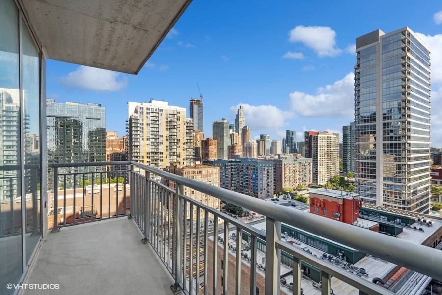 701 South Wells Street, Unit 1904 Chicago, IL 60607 - Photo 9 of 22 a view of city from a balcony