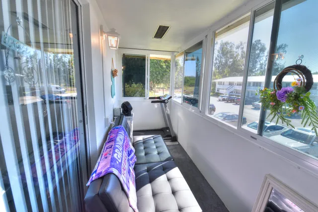 a living room with large windows