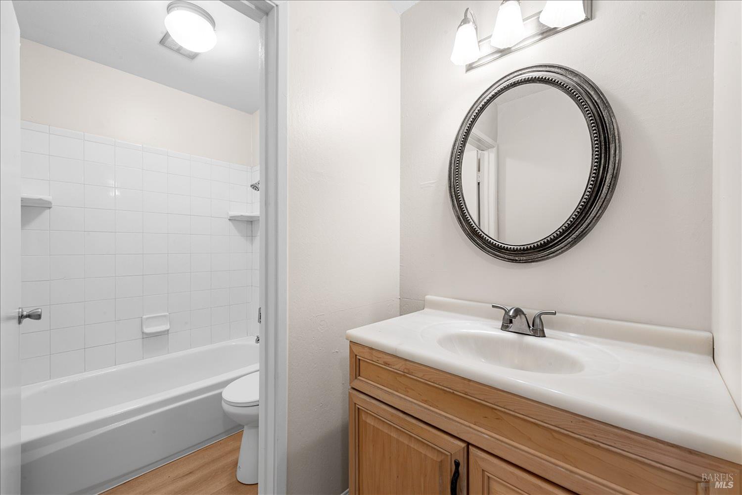 130 Del Rio Circle, Unit 2 Vacaville, CA 95687 - Photo 17 of 33 a bathroom with a sink a toilet and a mirror
