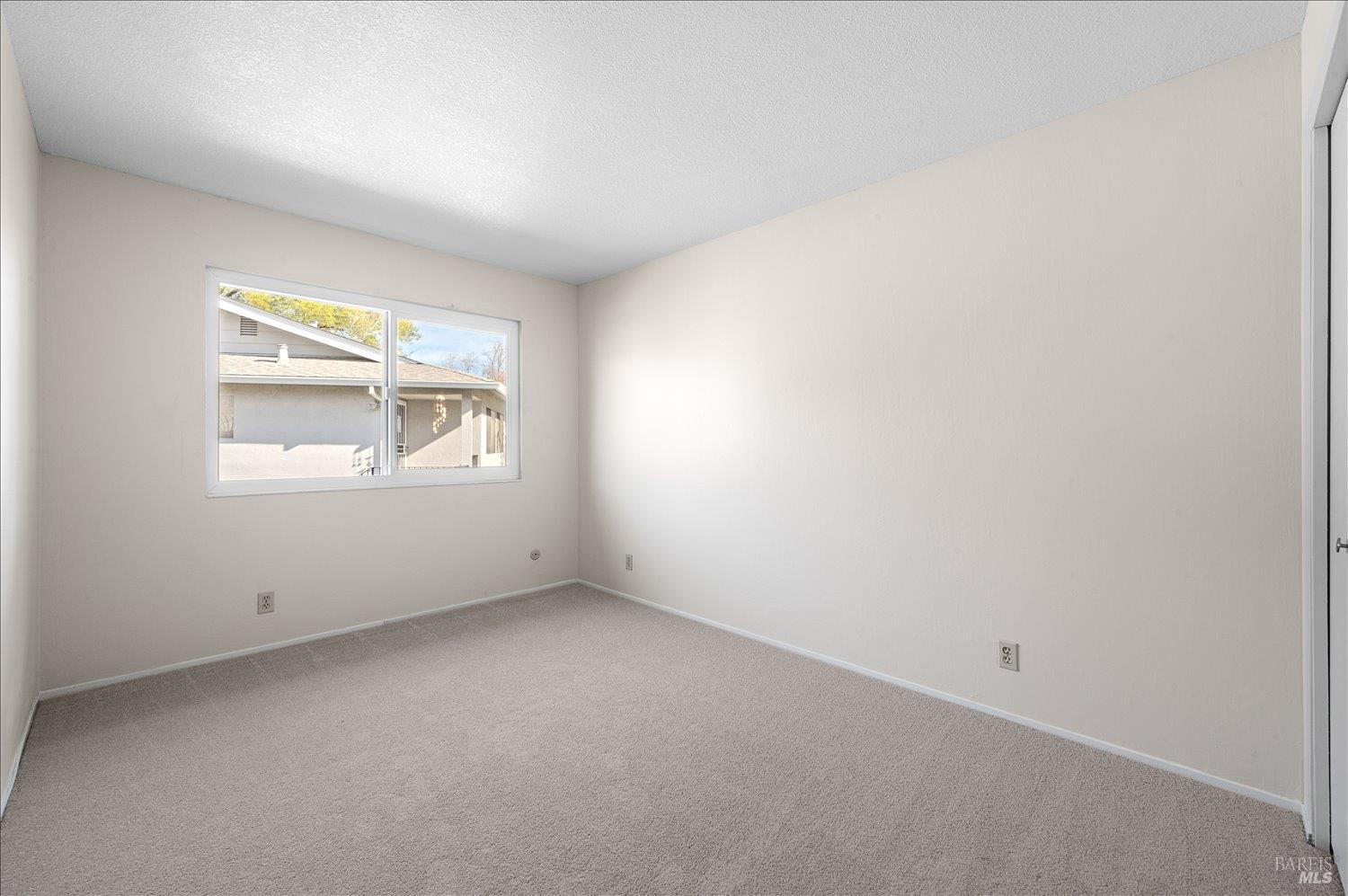 130 Del Rio Circle, Unit 2 Vacaville, CA 95687 - Photo 19 of 33 an empty room with a window