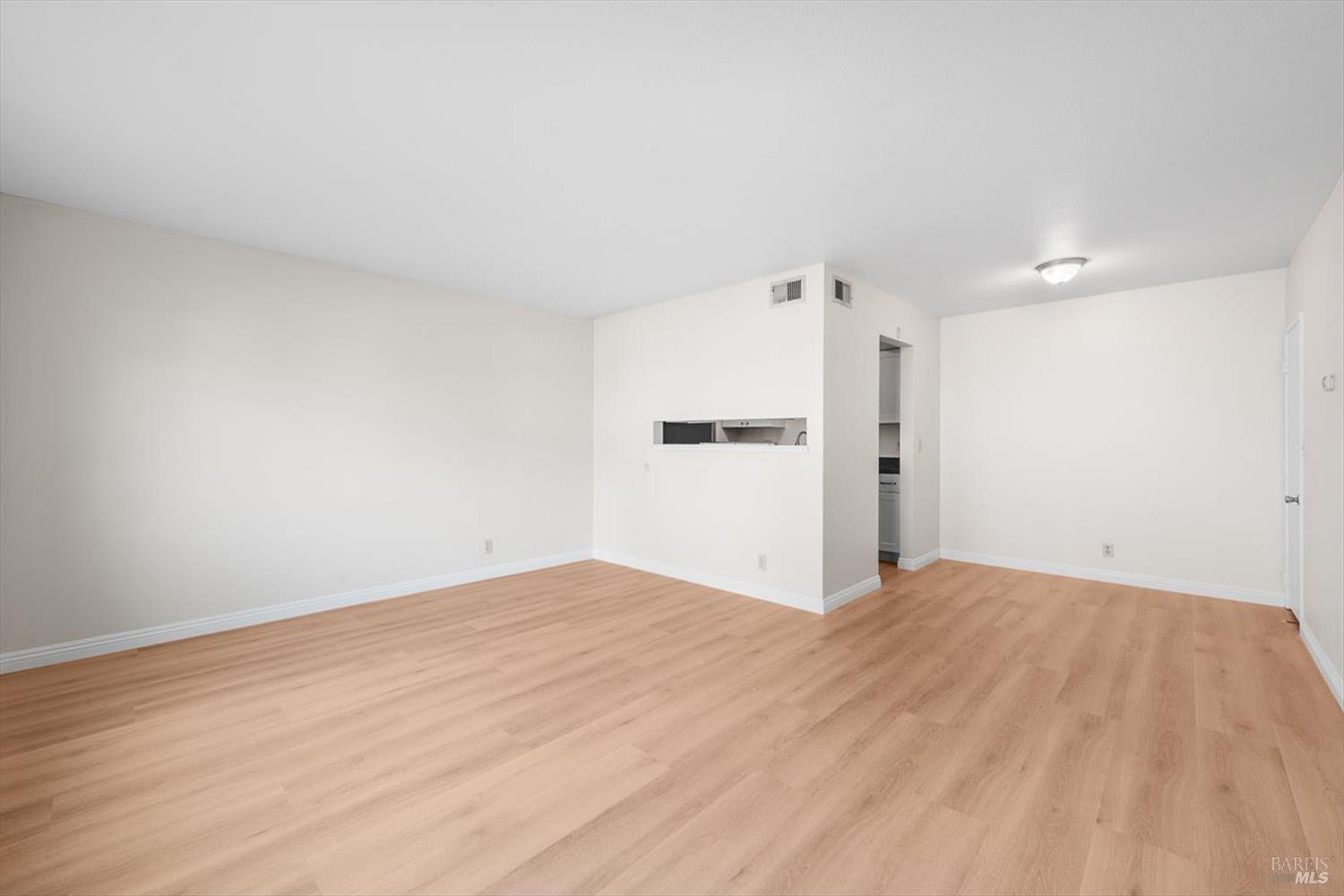 130 Del Rio Circle, Unit 2 Vacaville, CA 95687 - Photo 3 of 33 a view of empty room with wooden floor