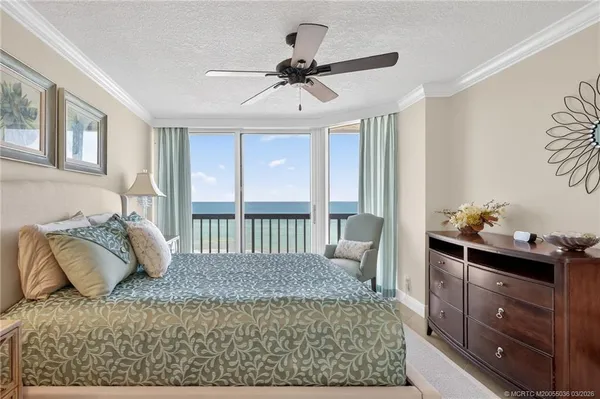 a bedroom with a bed and dresser