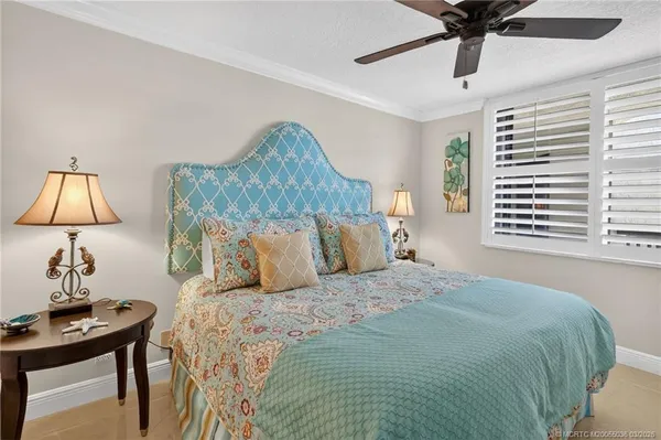 a bedroom with a bed and a table