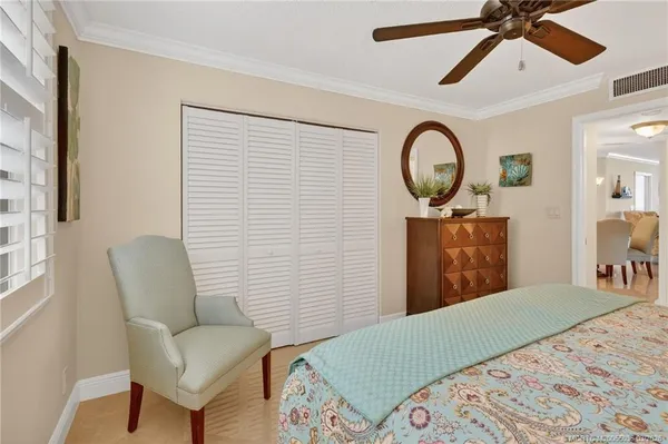 a bedroom with a bed and a chair