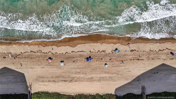 a view of ocean with a mountain