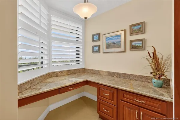 a view of a kitchen cabinets a sink and a window