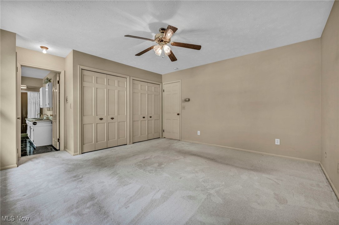 38814 Johnnycake Ridge Road Willoughby, OH 44094 - Photo 30 of 48 bedroom with multiple closets, and carpet floors