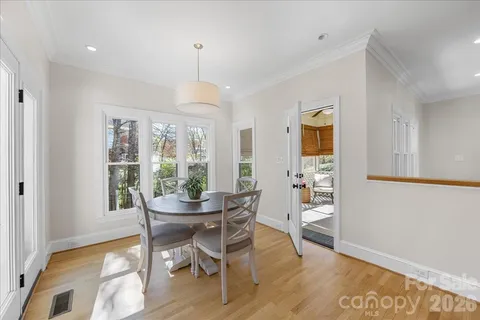 a view of backyard with seating area and green space