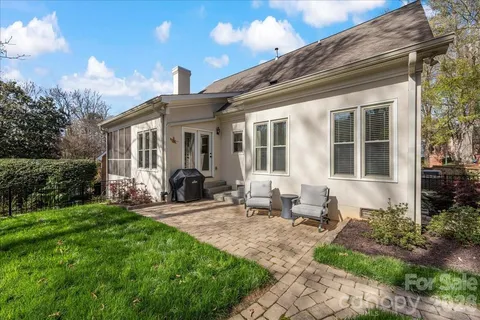 a spacious bedroom with a bed and a window