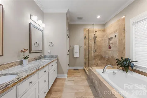 a living room with stainless steel appliances wooden floor and a window