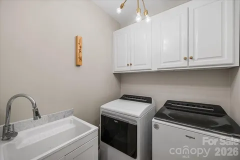 a bedroom with a bed and a tv