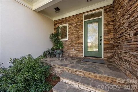 a view of living room with furniture and flat screen tv