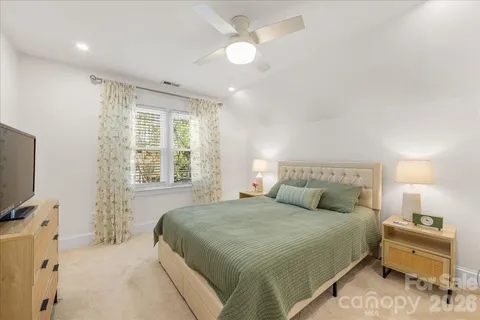 a view of a garden with a building in the background