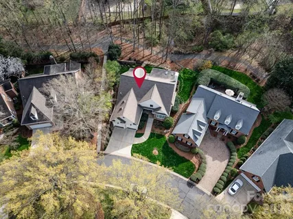 a view of a house with backyard sitting area and garden