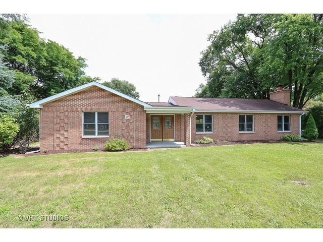 21 South Elmhurst Road Prospect Heights, IL 60070 - Photo 1 of 13 a front of a house with a garden