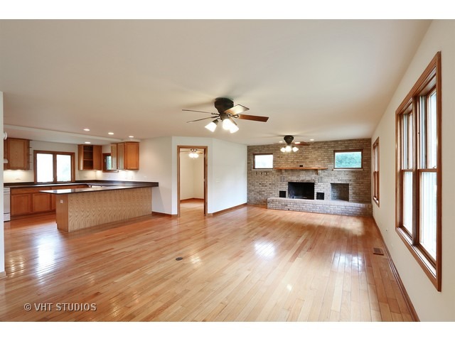 21 South Elmhurst Road Prospect Heights, IL 60070 - Photo 5 of 13 a view of kitchen and hall with wooden floor