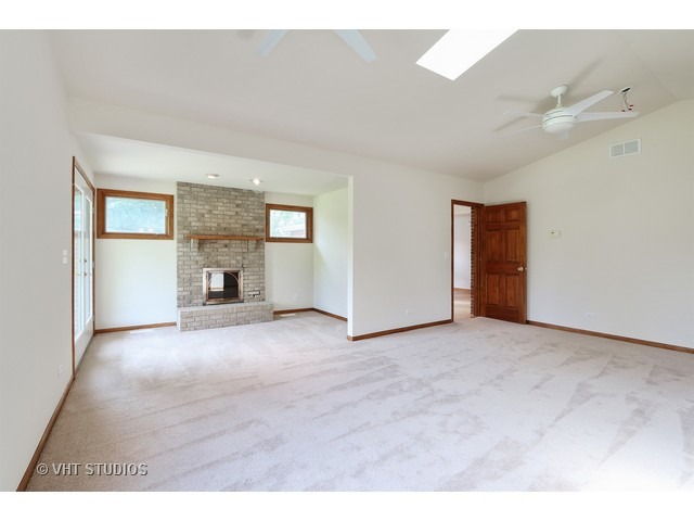 21 South Elmhurst Road Prospect Heights, IL 60070 - Photo 6 of 13 a view of empty room with a fireplace