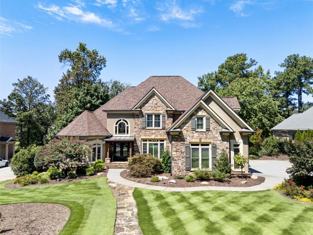 a front view of a house with a yard