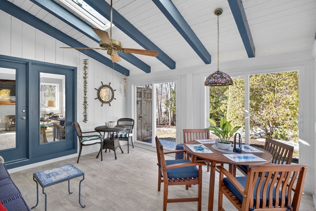 31 High Head Road Dennis, MA 02660 - Photo 17 of 32 a view of a dining room with furniture window and wooden floor