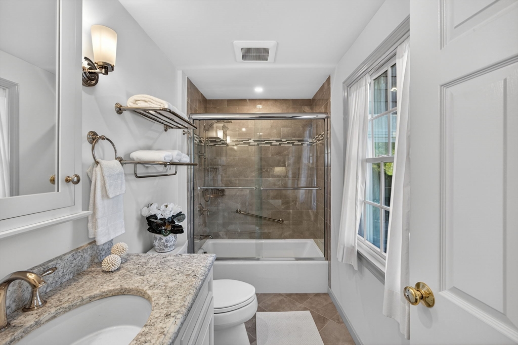 31 High Head Road Dennis, MA 02660 - Photo 22 of 32 a bathroom with a granite countertop sink toilet and shower