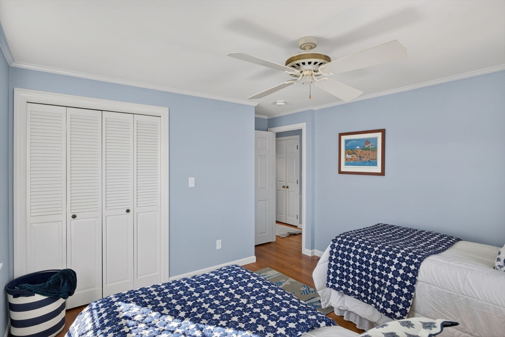 31 High Head Road Dennis, MA 02660 - Photo 24 of 32 a bedroom with a bed and a table