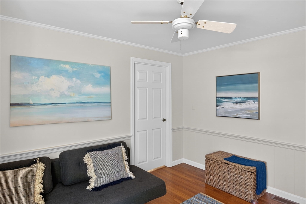 31 High Head Road Dennis, MA 02660 - Photo 28 of 32 a bedroom with furniture and a chandelier