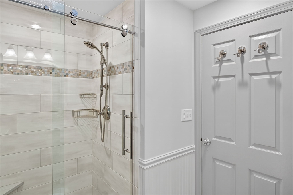 31 High Head Road Dennis, MA 02660 - Photo 30 of 32 a bathroom with a glass shower door