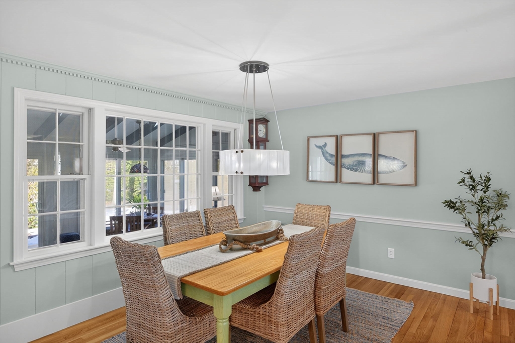 31 High Head Road Dennis, MA 02660 - Photo 8 of 32 a dining room with furniture a chandelier and wooden floor