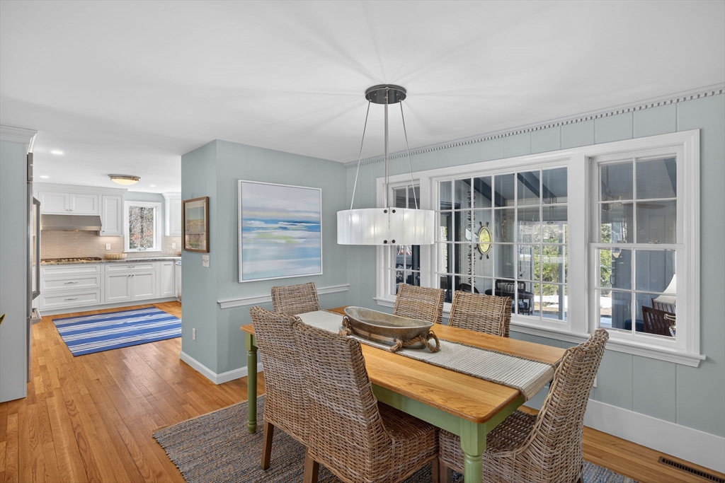 31 High Head Road Dennis, MA 02660 - Photo 9 of 32 a dining room with furniture a chandelier and wooden floor