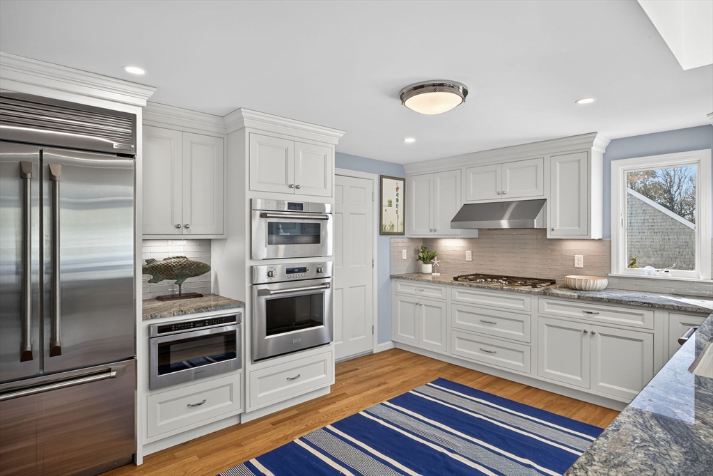 31 High Head Road Dennis, MA 02660 - Photo 10 of 32 a kitchen with stainless steel appliances granite countertop a refrigerator oven a sink and dishwasher