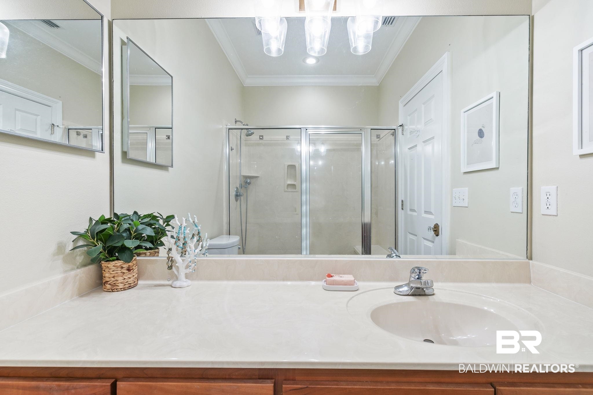 17341 Cabin Road Loxley, AL 36551 - Photo 27 of 49 Bathroom featuring toilet, vanity, ornamental molding, and a shower with shower door