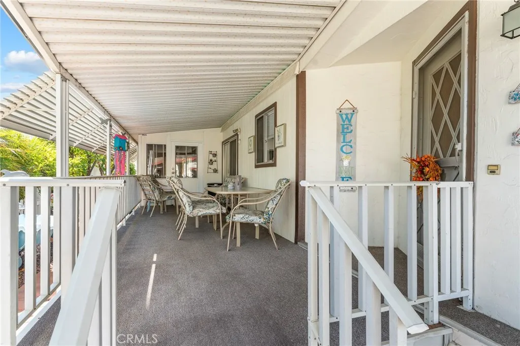 35218 Fir, Unit 183 Yucaipa, CA 92399 - Photo 2 of 35 a view of a porch with chairs