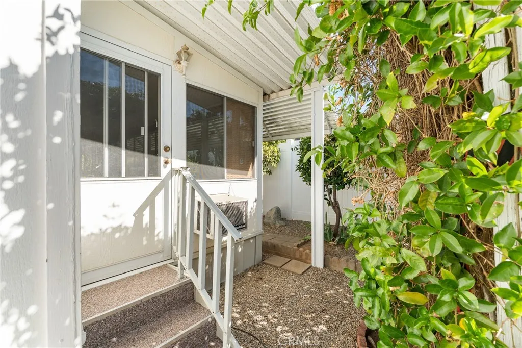 35218 Fir, Unit 183 Yucaipa, CA 92399 - Photo 29 of 35 a view of a balcony with chair and table
