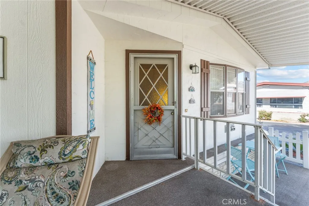 35218 Fir, Unit 183 Yucaipa, CA 92399 - Photo 4 of 35 a view of a livingroom with furniture and front door