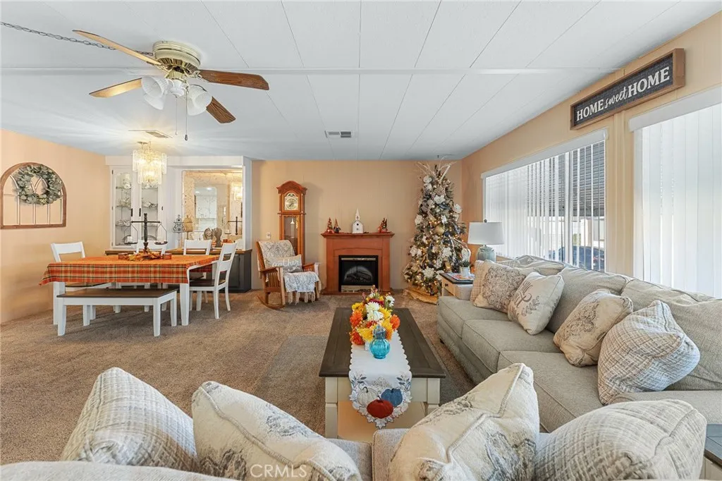 35218 Fir, Unit 183 Yucaipa, CA 92399 - Photo 8 of 35 a living room with furniture or fireplace and a large window