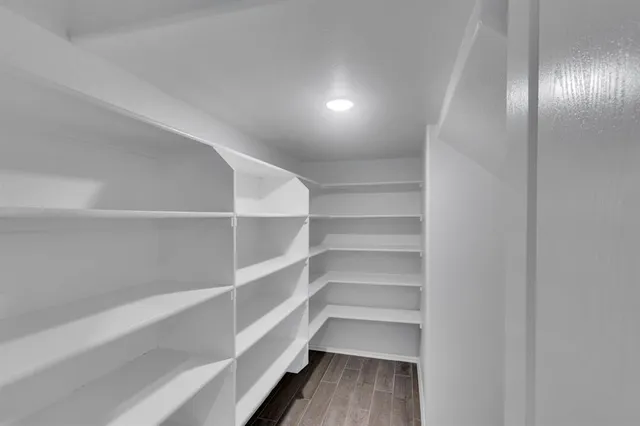 a view of a room with shelf on the wall