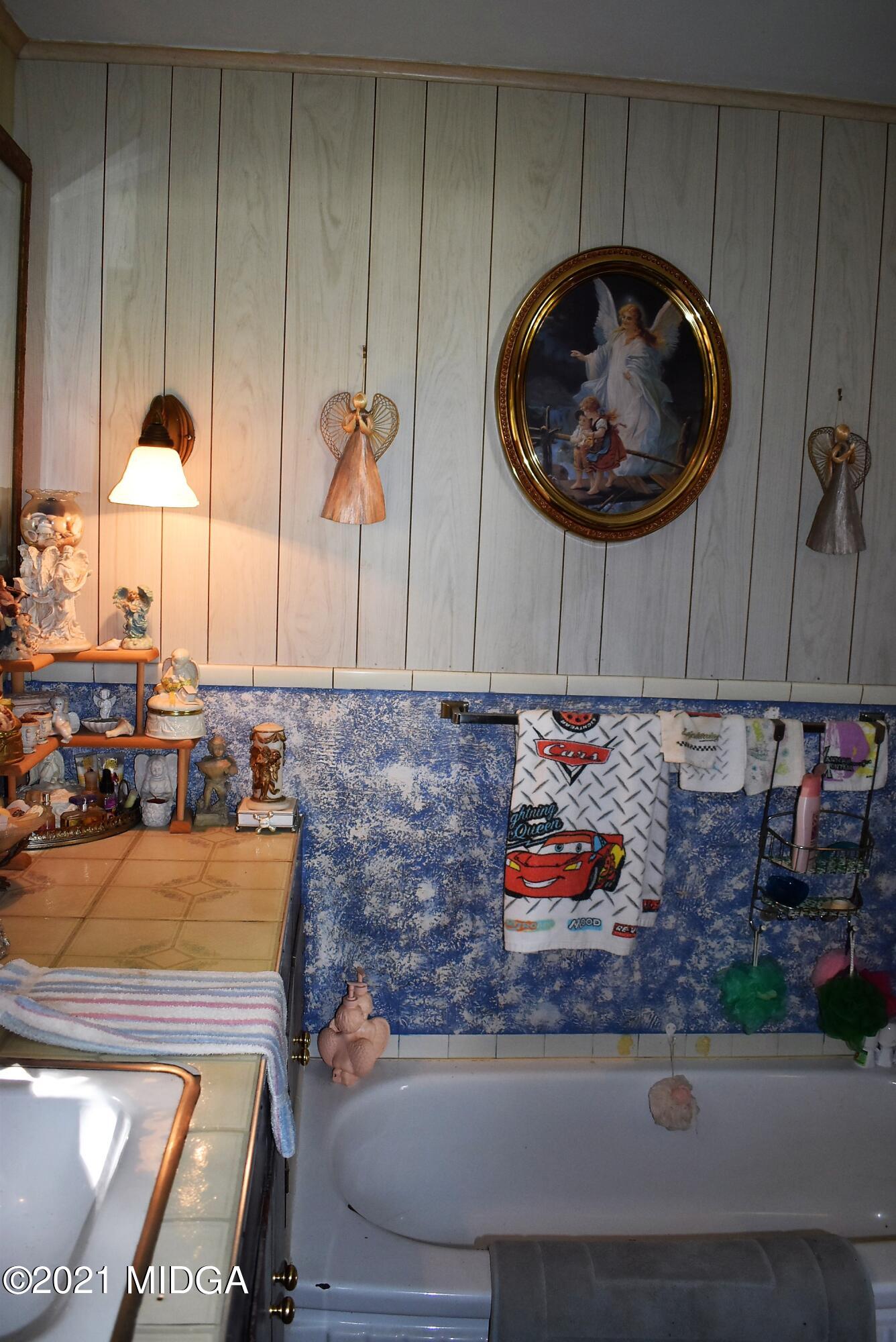 4238 Jones Road Macon, GA 31216 - Photo 20 of 31 an aerial view of a kitchen with a fireplace and lots of clutter