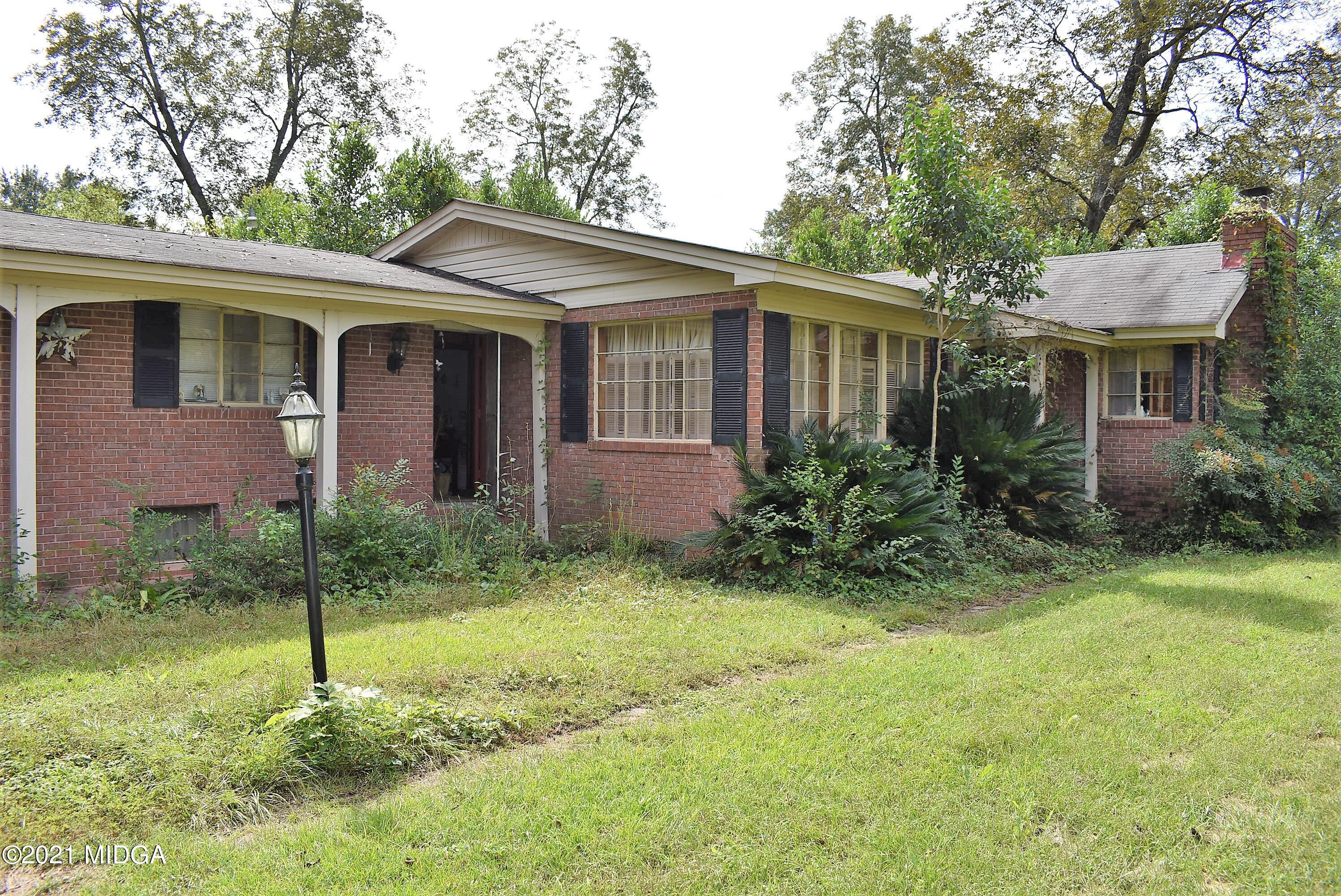 4238 Jones Road Macon, GA 31216 - Photo 2 of 31 a view of a house with a yard and plants