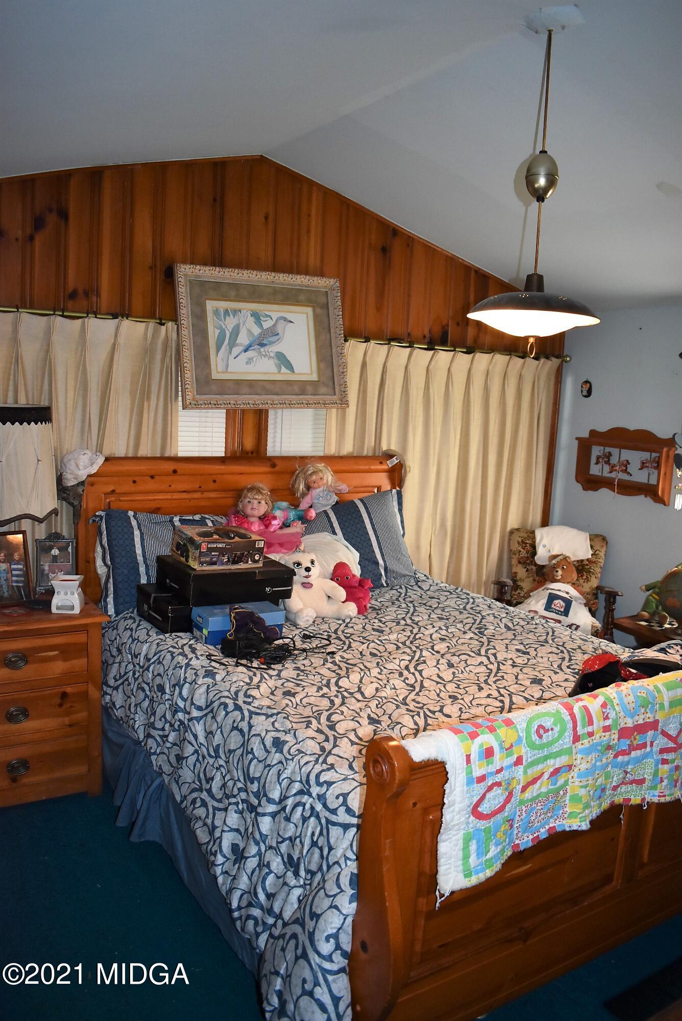 4238 Jones Road Macon, GA 31216 - Photo 22 of 31 a living room filled with furniture and a table