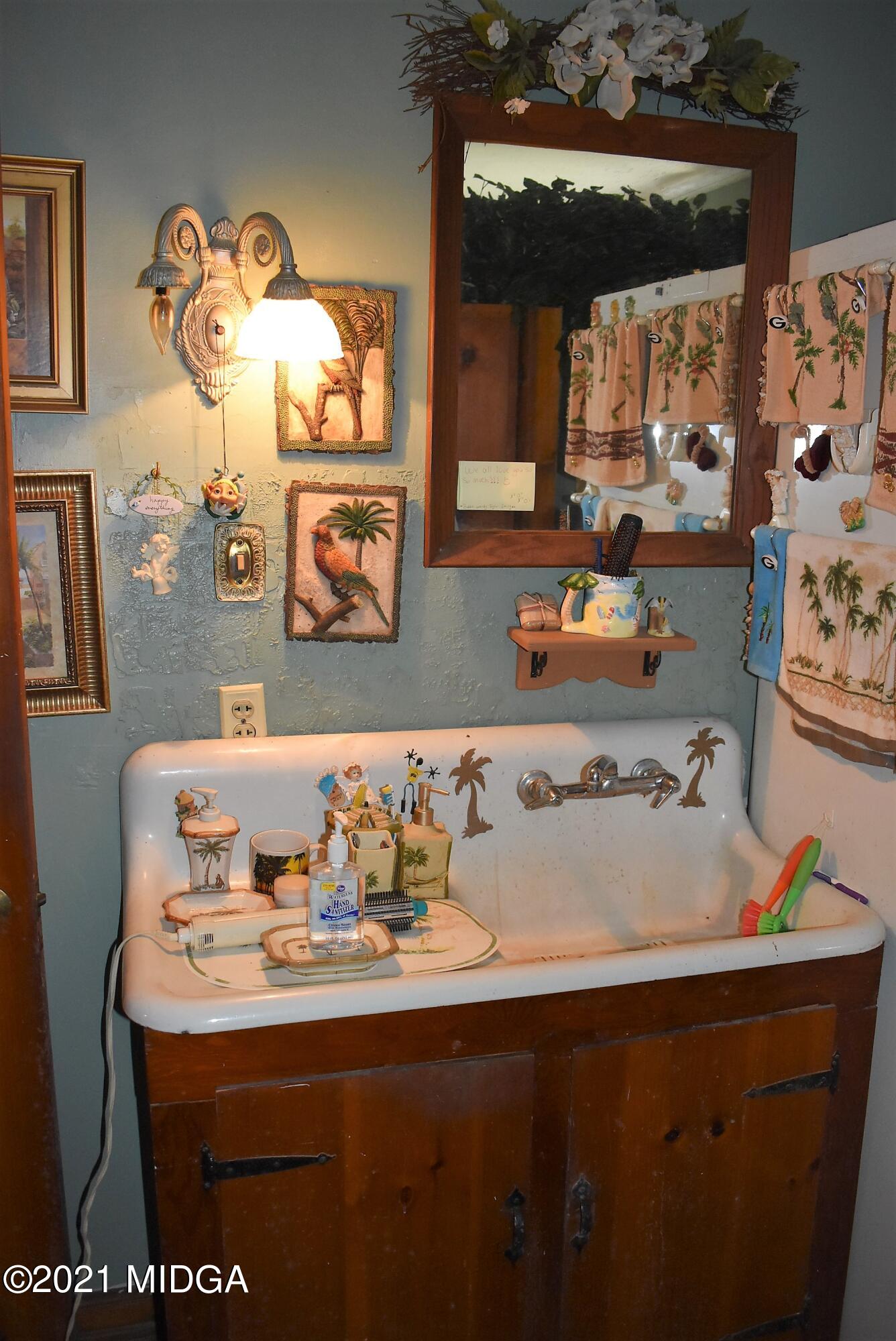 4238 Jones Road Macon, GA 31216 - Photo 26 of 31 a room with furniture and painting on the wall
