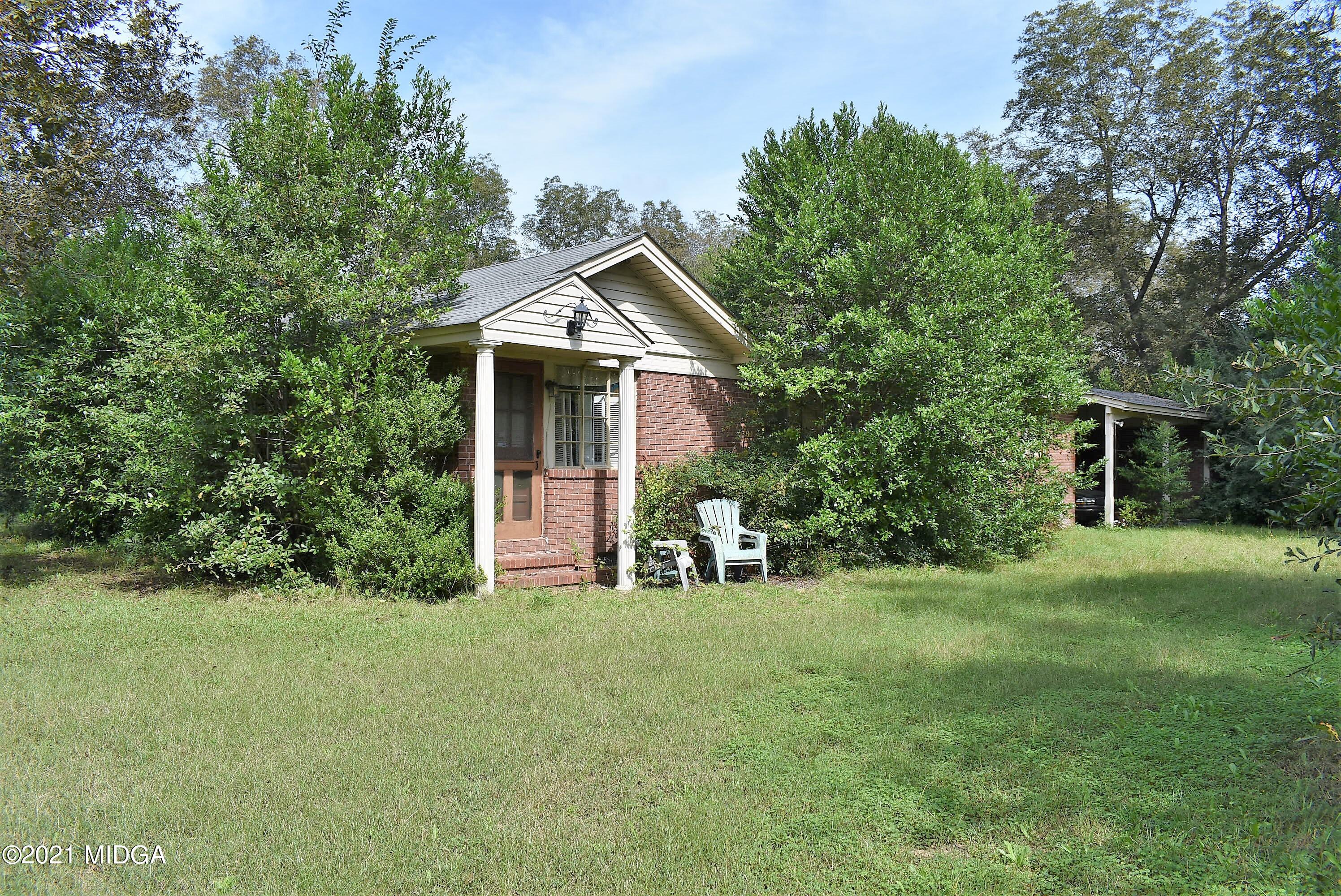 4238 Jones Road Macon, GA 31216 - Photo 29 of 31 a front view of a house with a yard