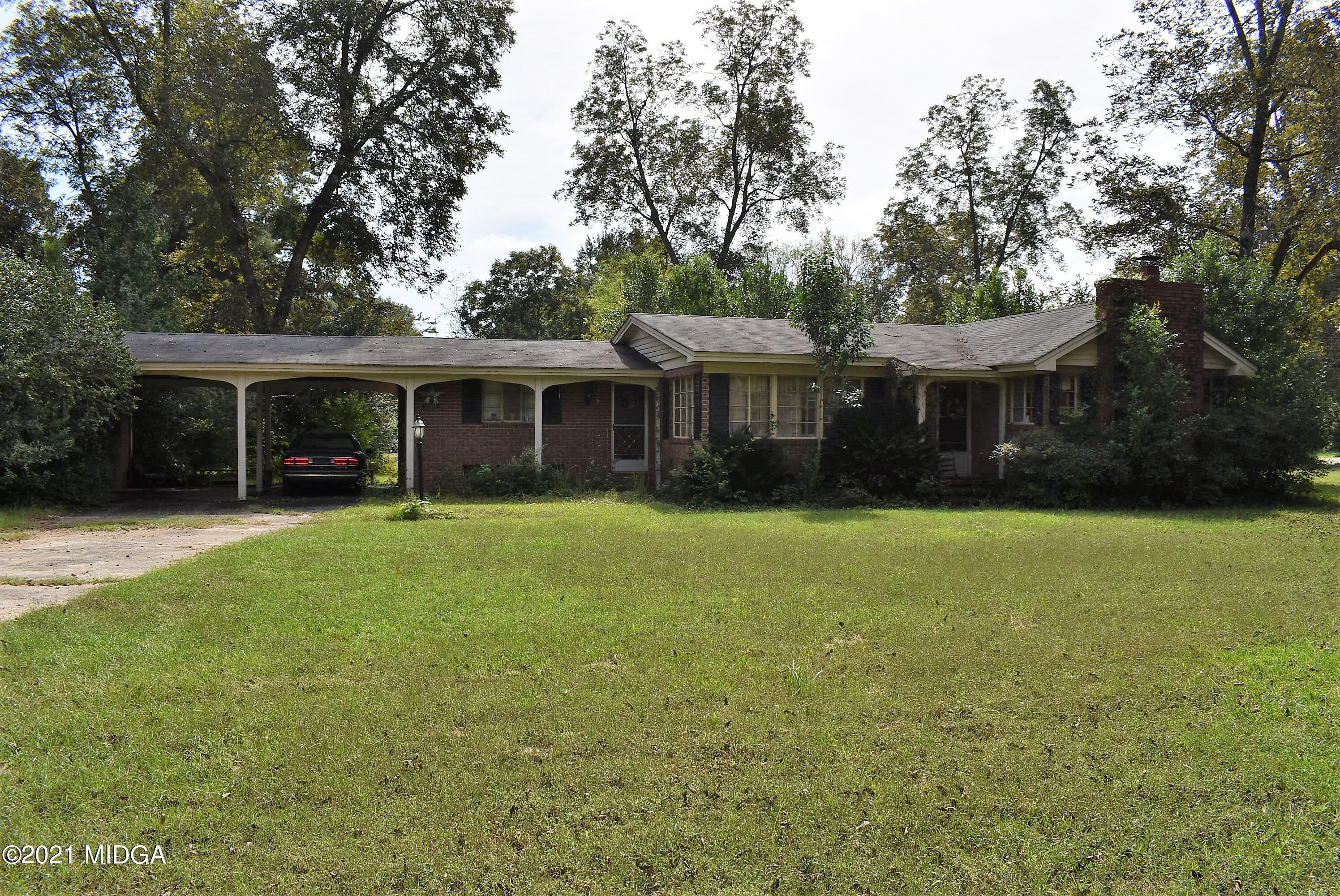 4238 Jones Road Macon, GA 31216 - Photo 31 of 31 a front view of a house with a yard and green space