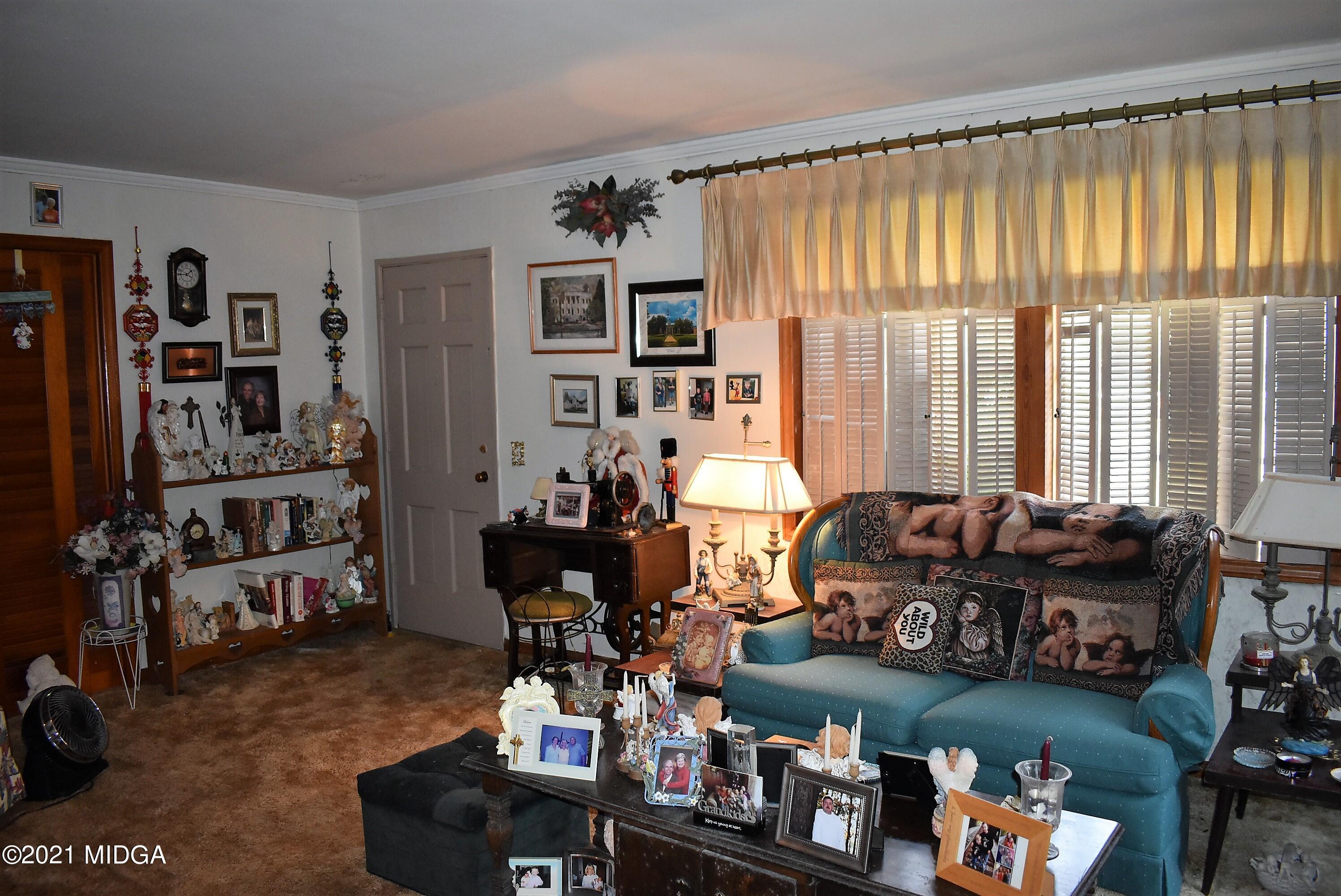 4238 Jones Road Macon, GA 31216 - Photo 5 of 31 a living room with furniture and a window