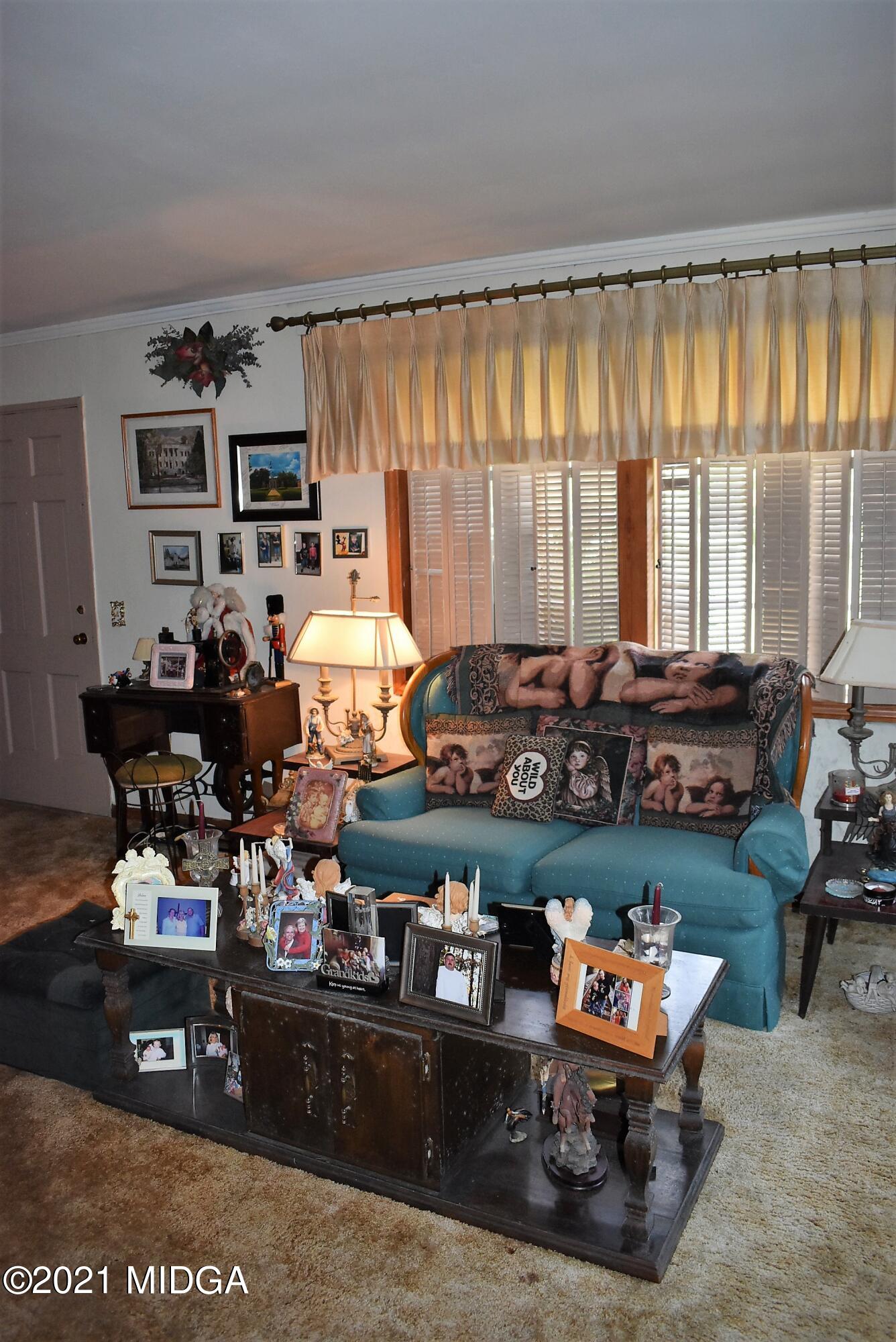 4238 Jones Road Macon, GA 31216 - Photo 6 of 31 a room with lots of furniture and decor