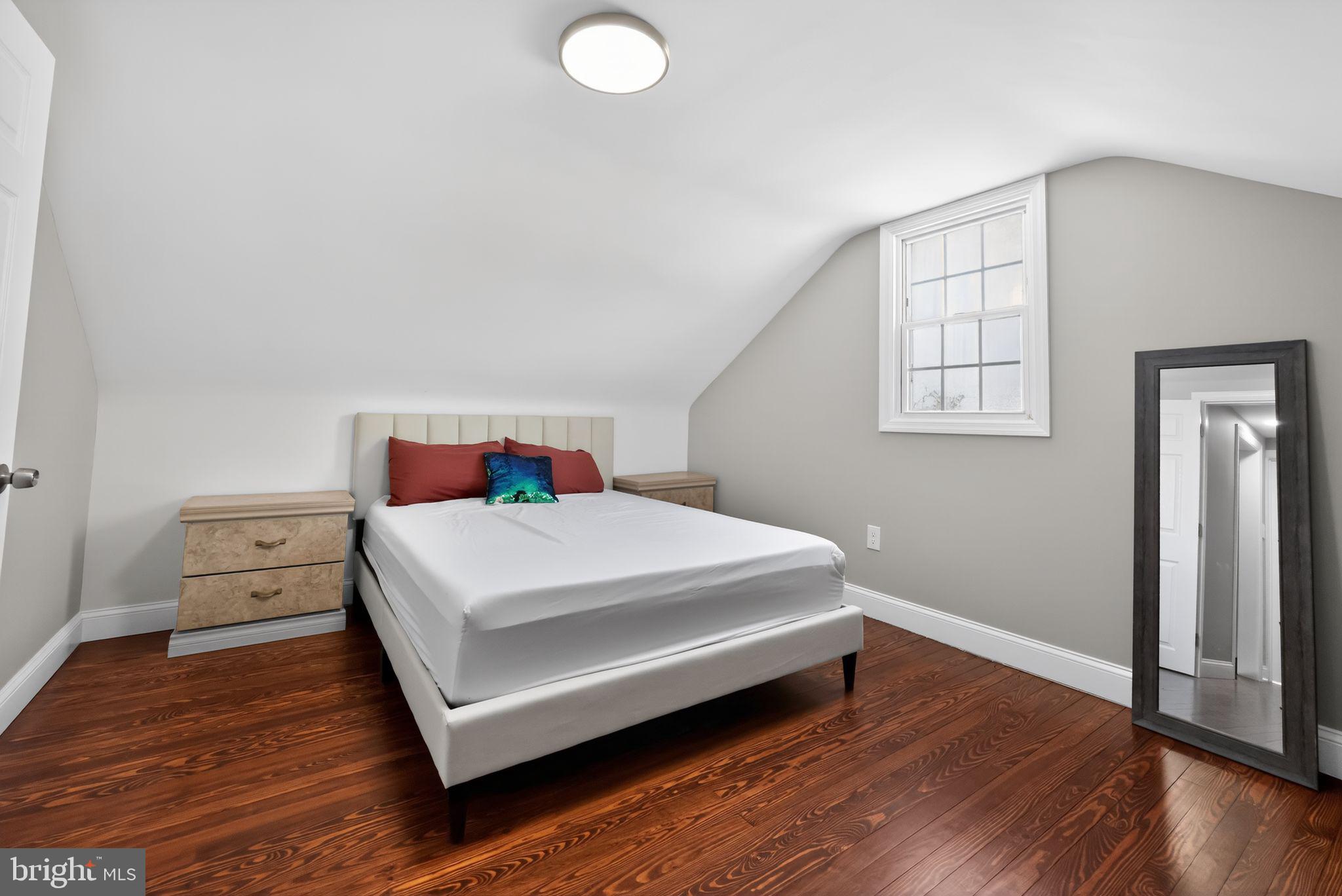 298 South Tuckahoe Road Williamstown, NJ 08094 - Photo 17 of 22 a bedroom with a bed and wooden floor